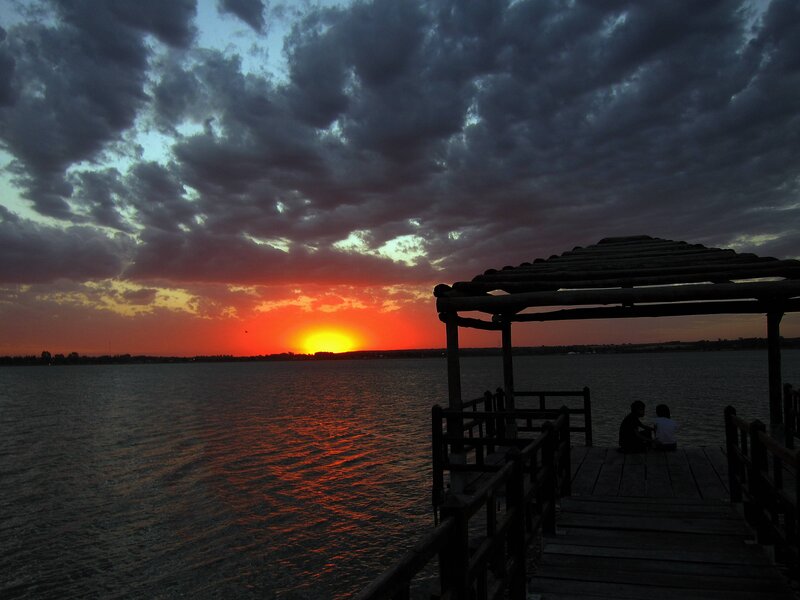 Two People on a Dock — Red