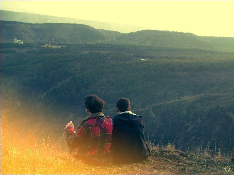 Two people on a hillside