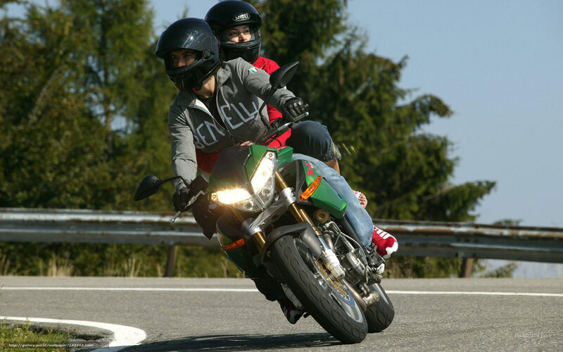 Two people on a motorcycle