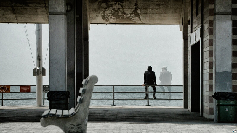 Two People on a Pier — Gray, Somber