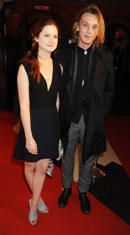 Two people on a red carpet