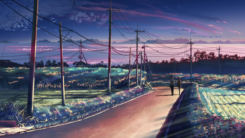 Two people on a road at dusk