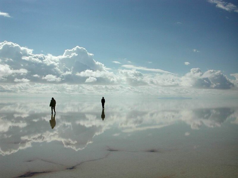 Two people on a salt flat