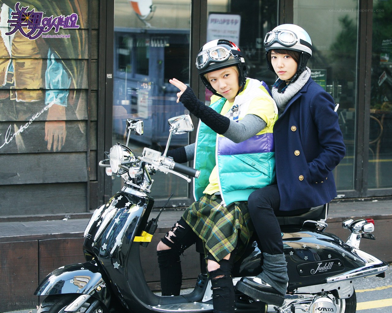 Two people on a scooter