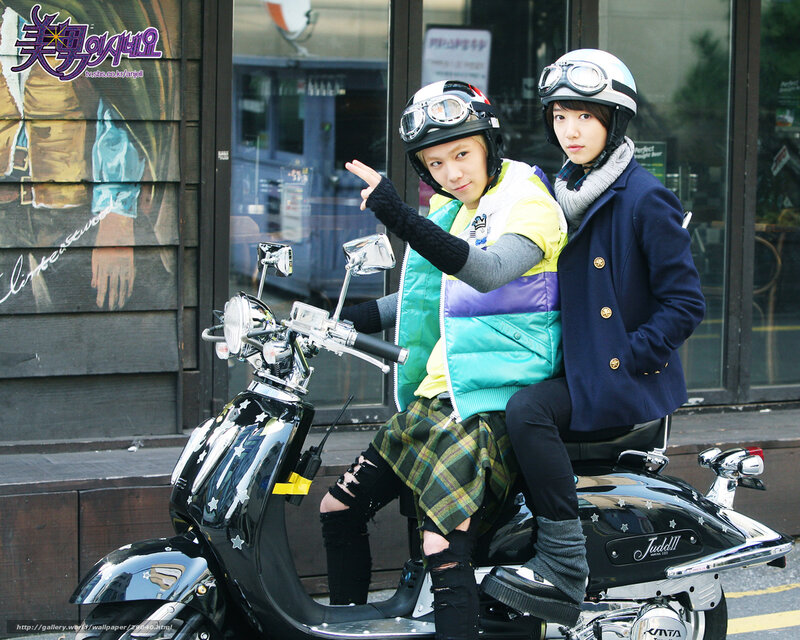 Two people on a scooter