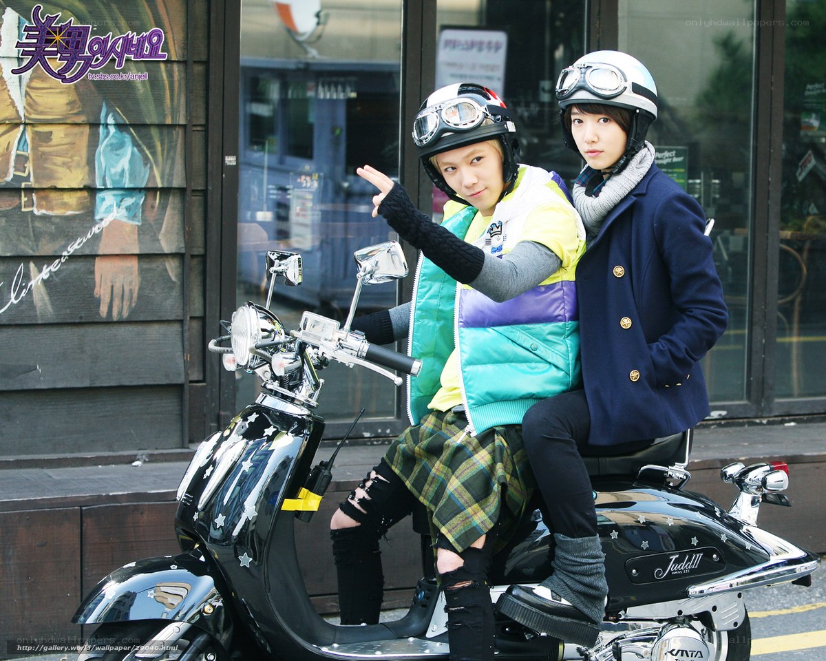 Two people on a scooter