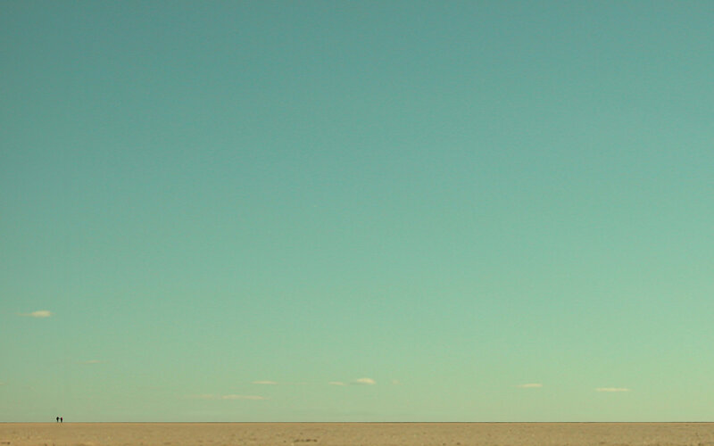 Two people on a vast plain