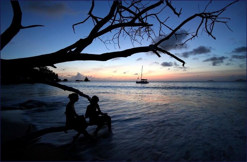 Two People on Beach — Blue, Serene, Sunset