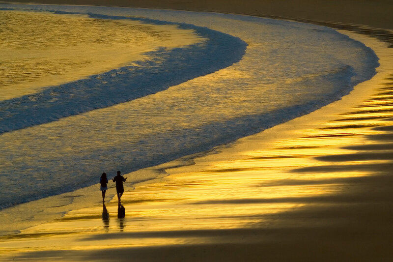 Two People on Beach — Gold, Serene