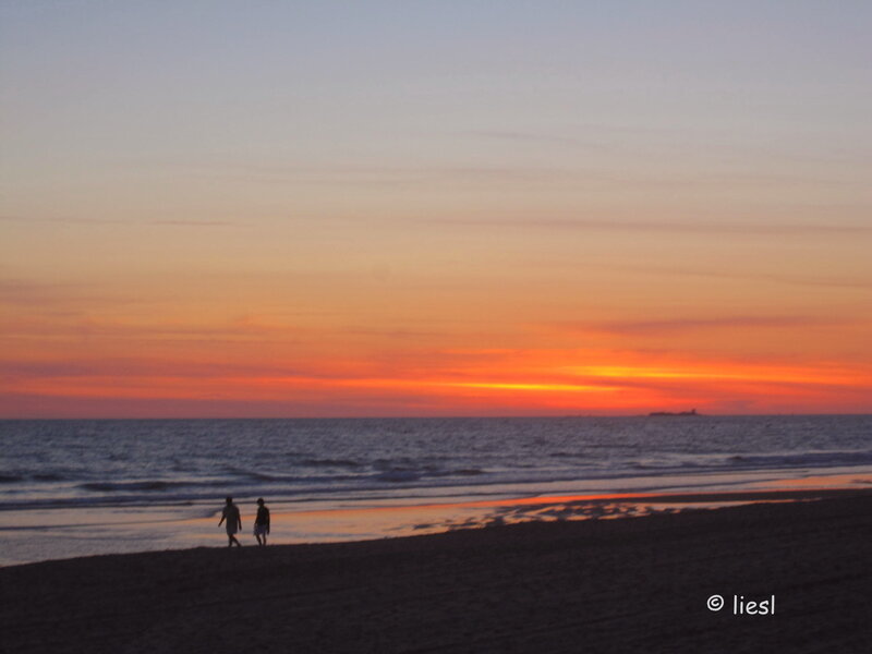 Two People on Beach — Orange, Serene, Sunset