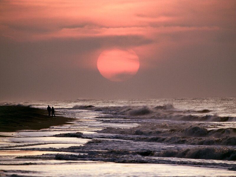 Two People on Beach — Pink, Serene, Sunset