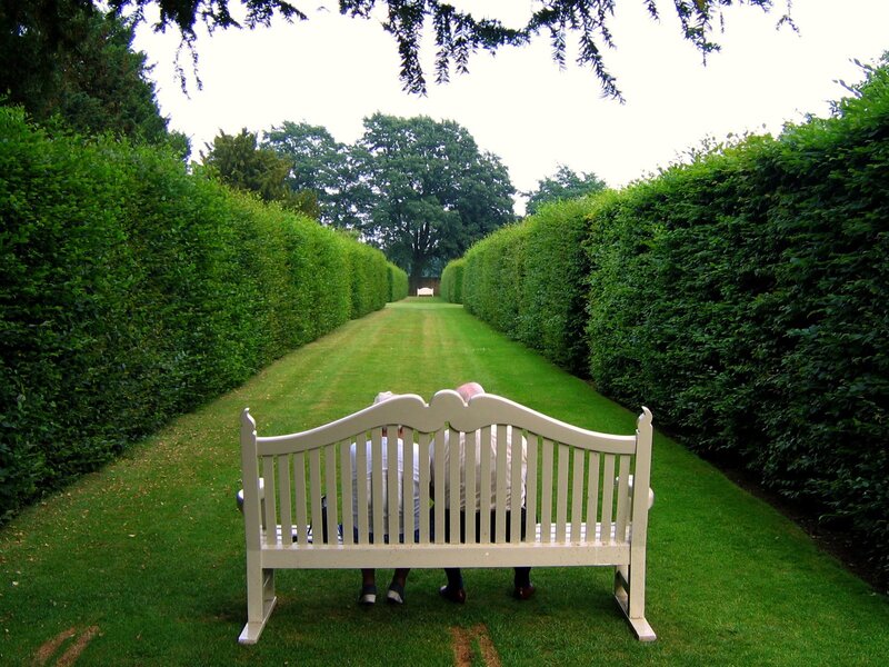 Two People on Bench — Green, Serene, Afternoon