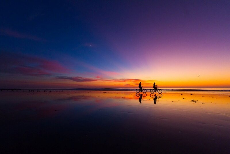 Two People on Bicycles — Purple