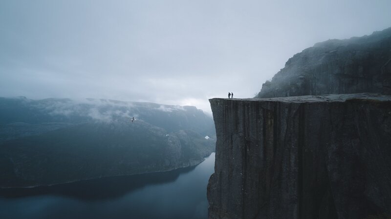 Two People on Cliff Edge — Gray, Dramatic