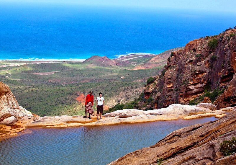 Two People on Cliff Edge