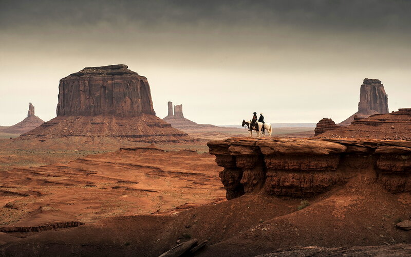 Two People on Horseback