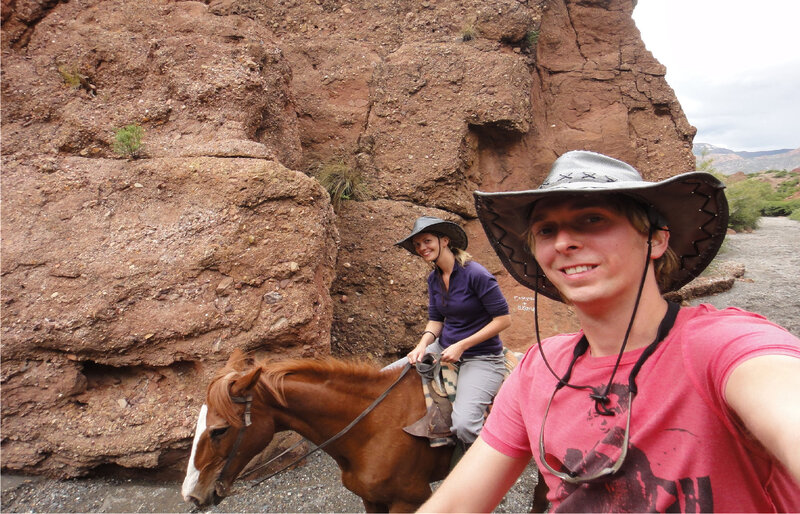 Two People on Horses — Brown