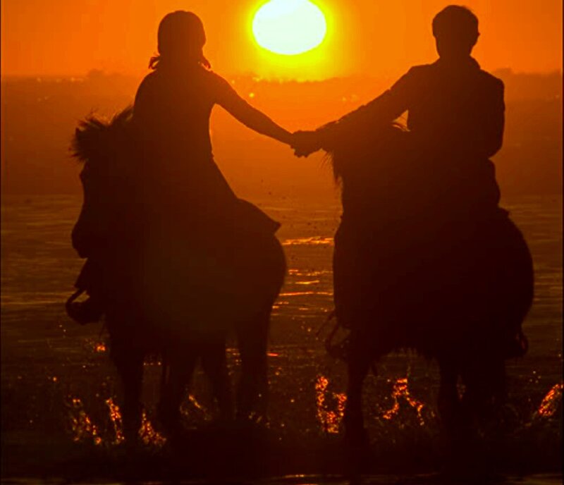 Two People on Horses — Orange, Dramatic