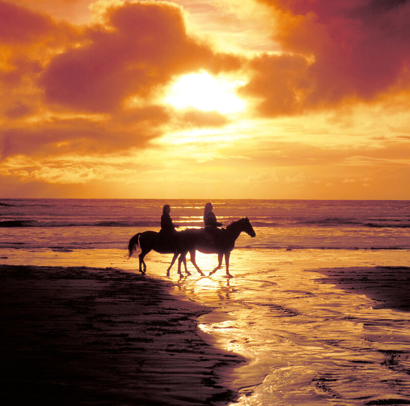 Two People on Horses — Orange