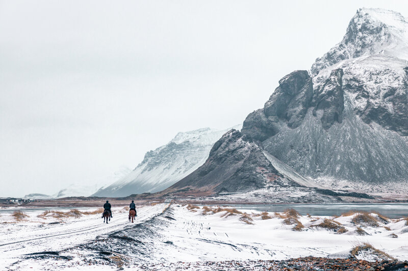 Two People on Horses — White, Serene