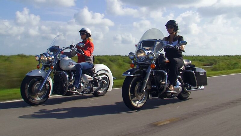 Two People on Motorcycles — White