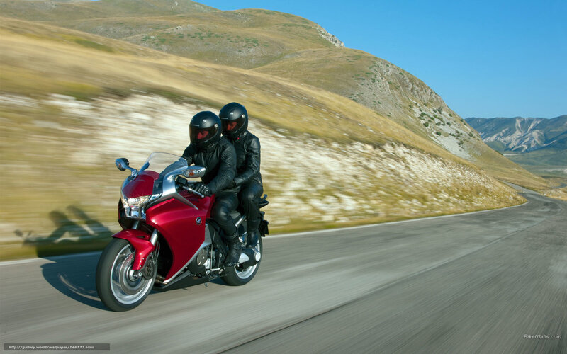 Two People on Red Motorcycle