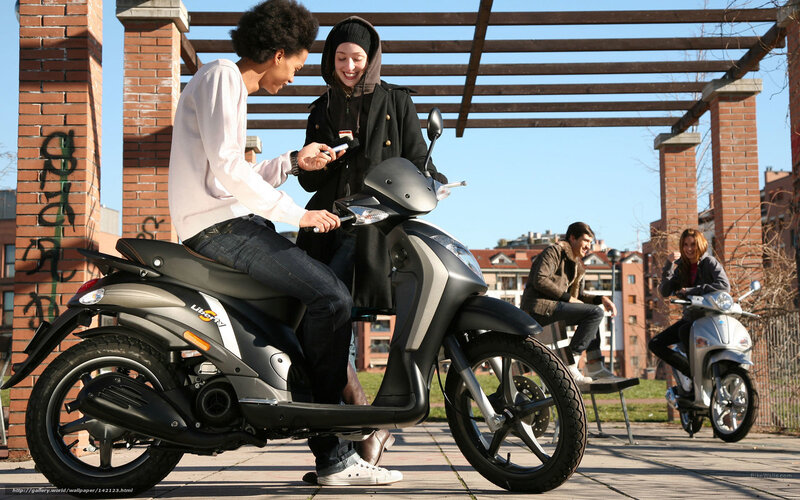 Two People on Scooter