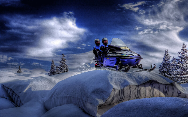 Two People on Snowmobile