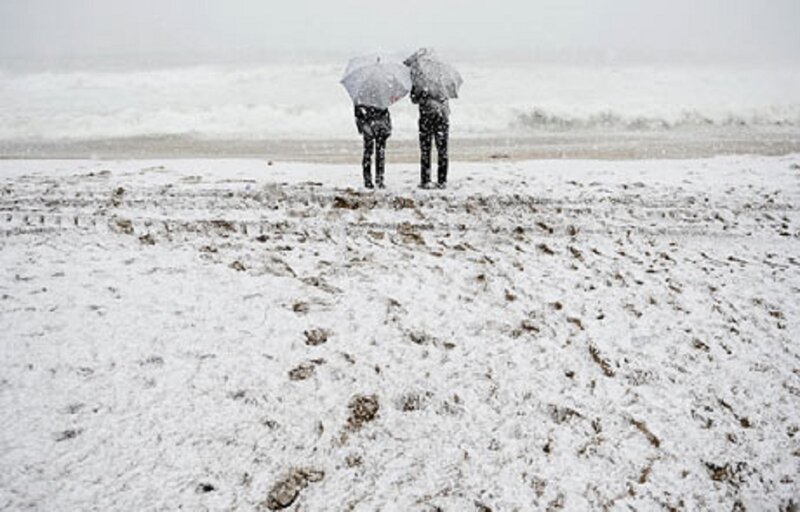 Two People on Snowy Beach