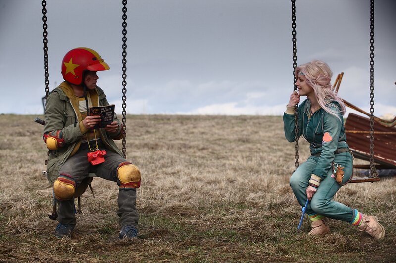 Two People on Swings — Green