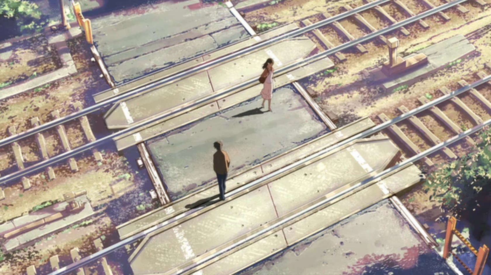two people on train tracks