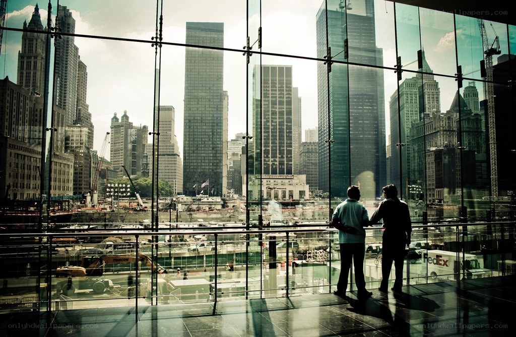Two people overlooking a city