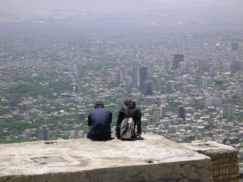 Two people overlooking a city