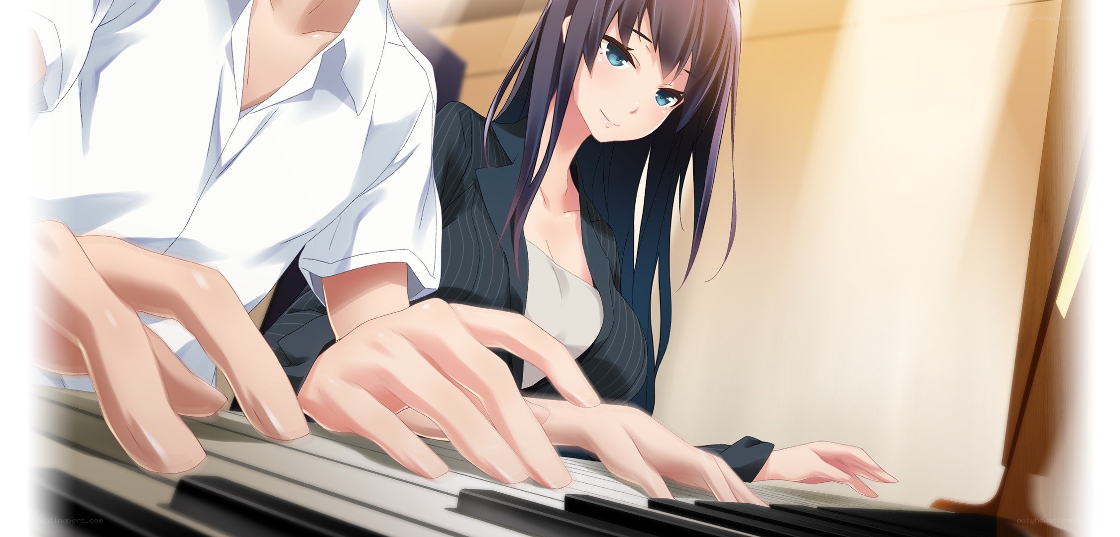 Two people playing piano together
