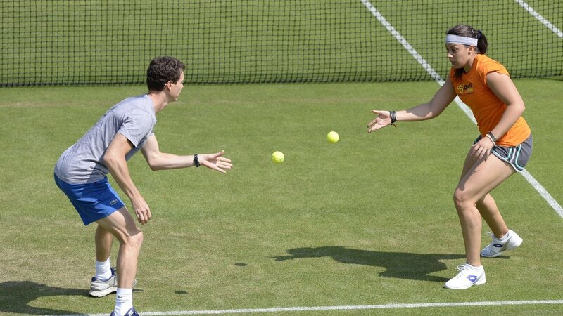 Two People Playing Tennis
