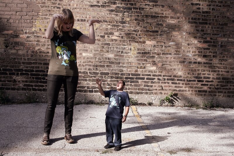 Two people posing with exaggerated expressions