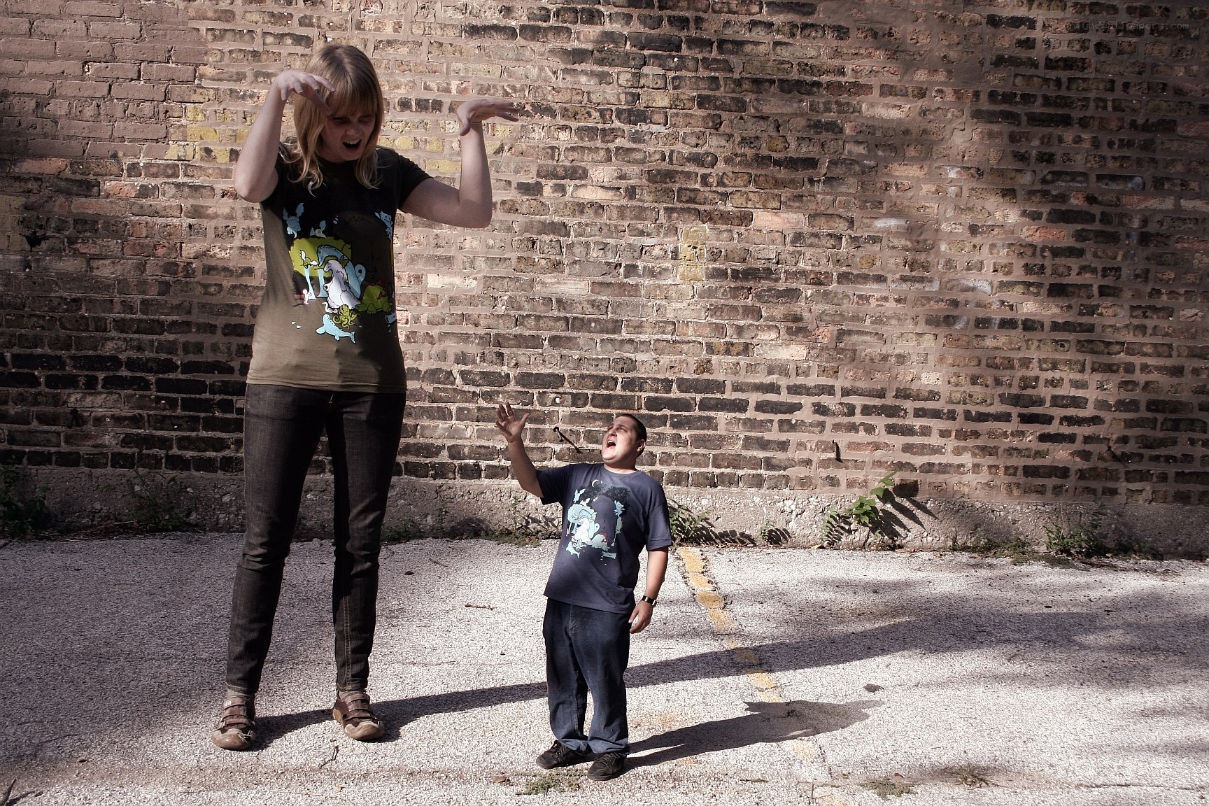 Two people posing with exaggerated expressions