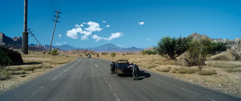 Two People Pushing a Car