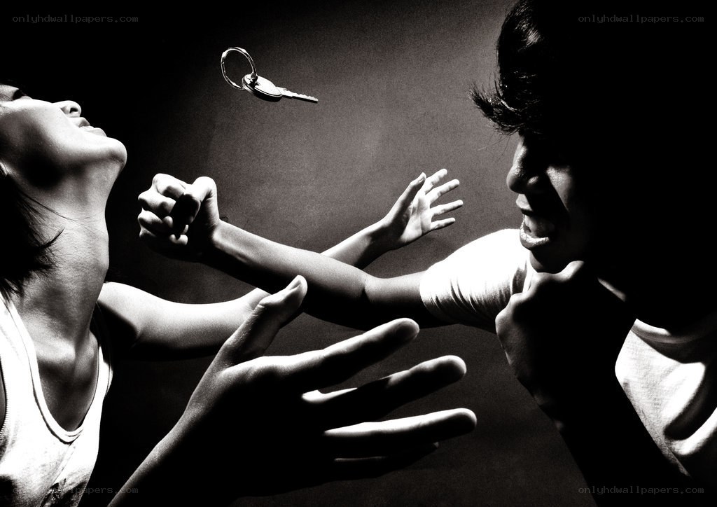 Two people reaching for a key
