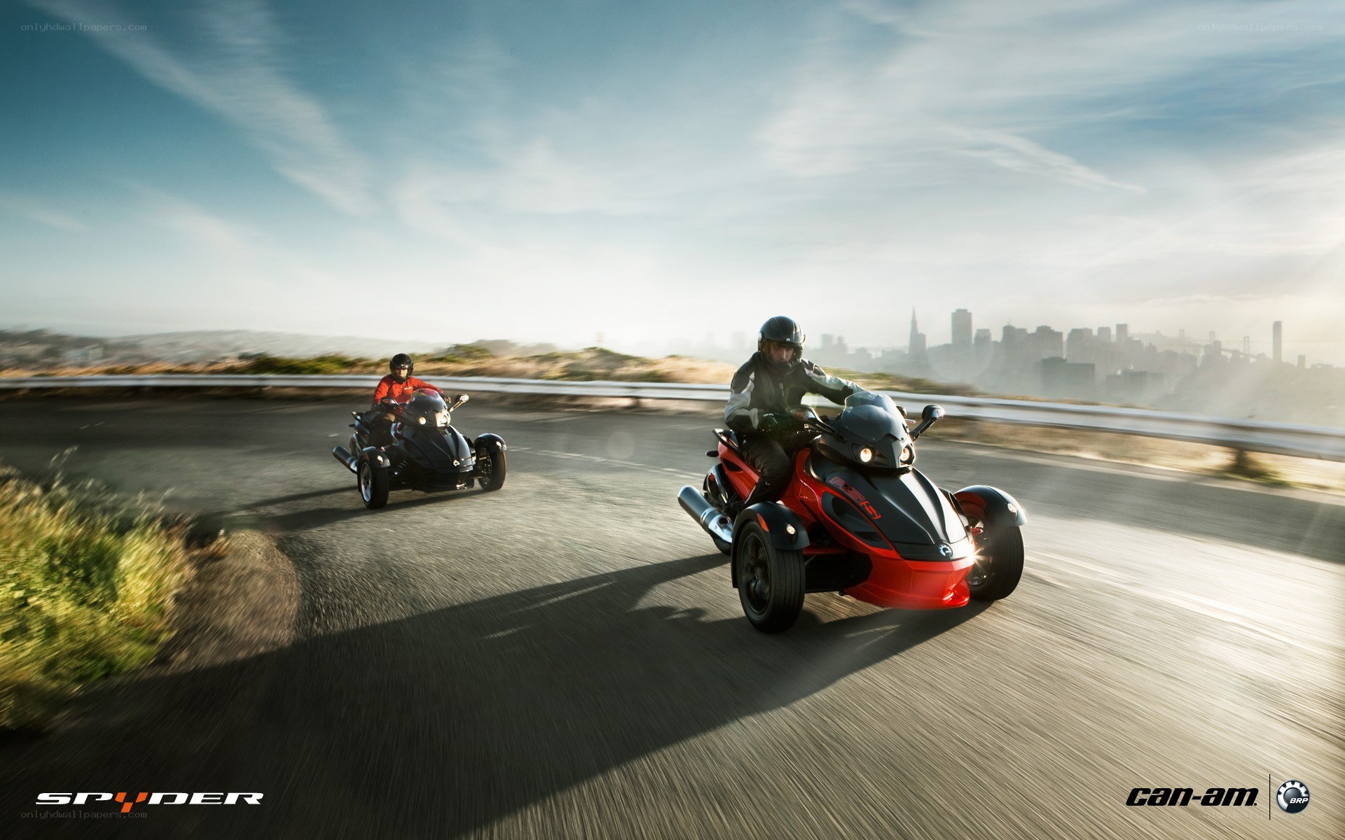 Two people riding three-wheeled vehicles