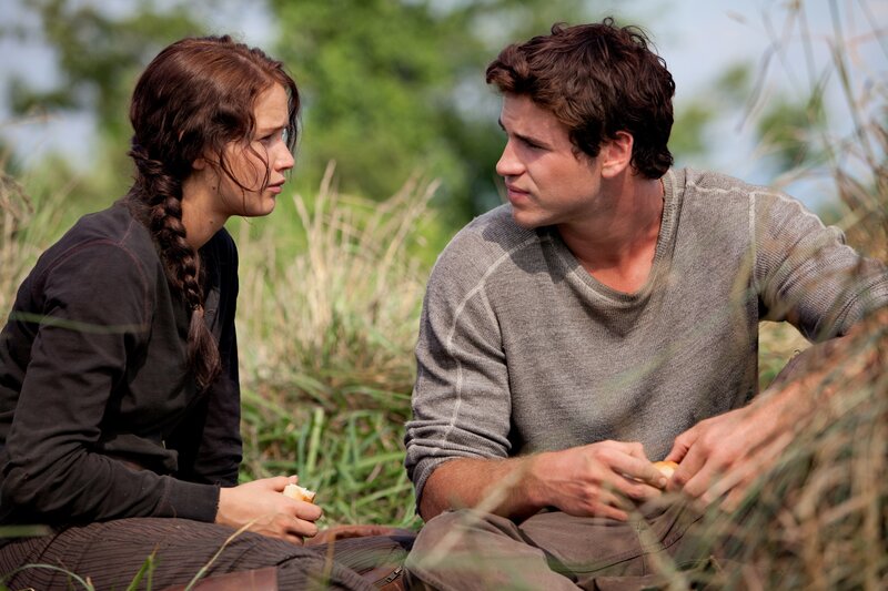 two people sharing a meal outdoors