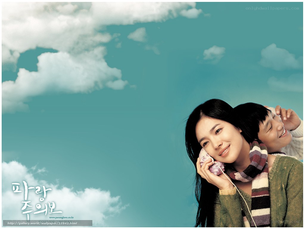 two people sharing headphones