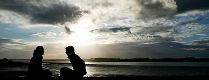 Two People Silhouetted — Gray