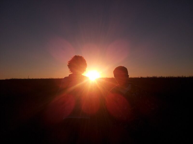 Two People Silhouetted — Orange, Dramatic, Sunset