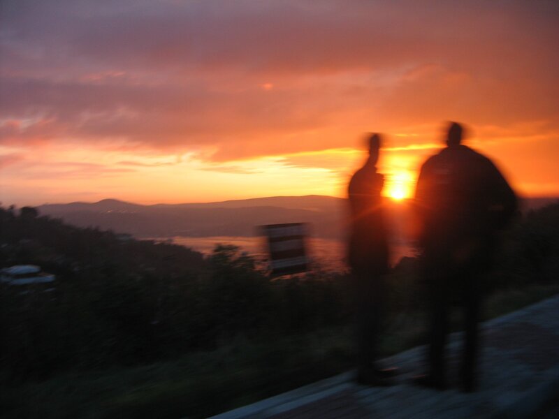 Two People Silhouetted — Orange, Dramatic