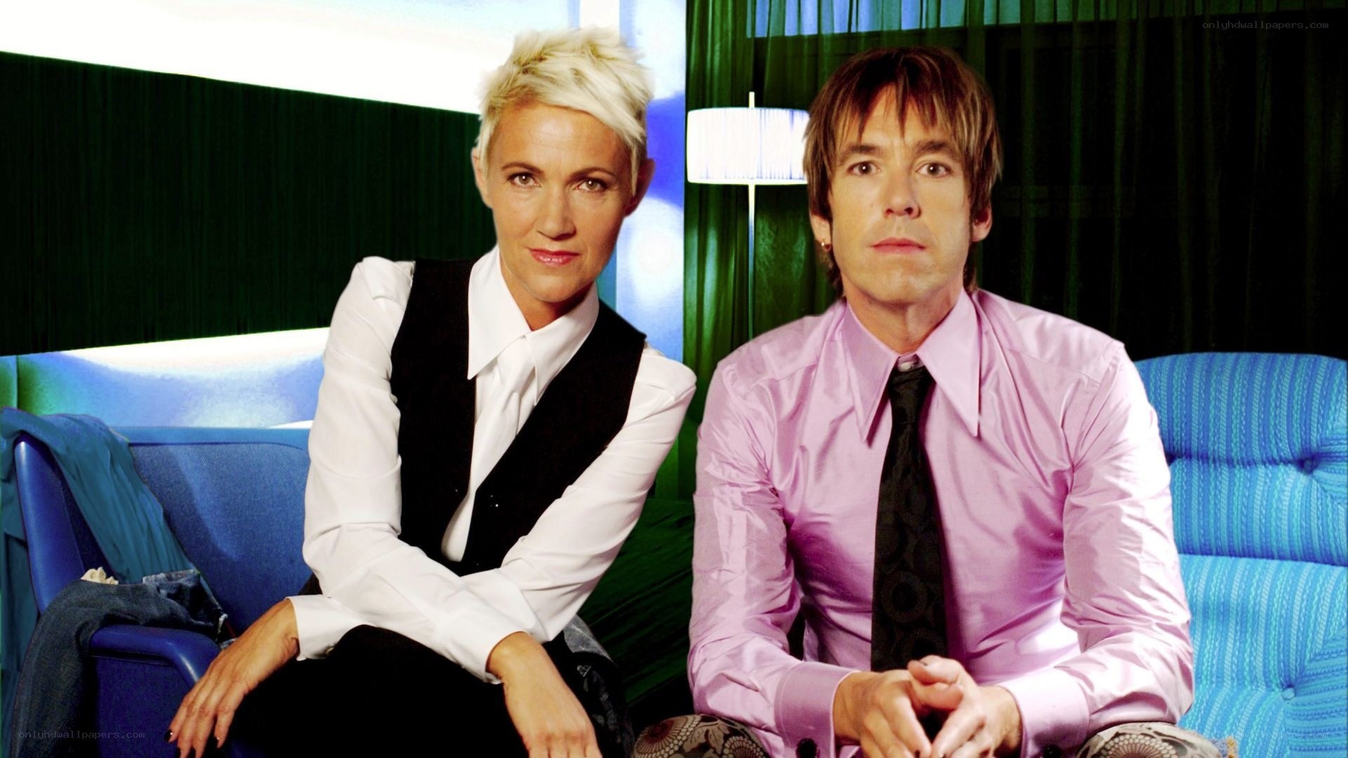 Two people sitting on a couch