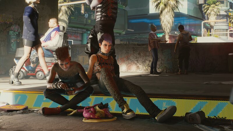 Two People Sitting on Curb