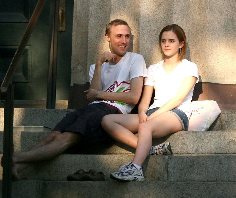 Two people sitting on steps