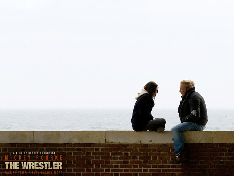 Two People Sitting on Wall