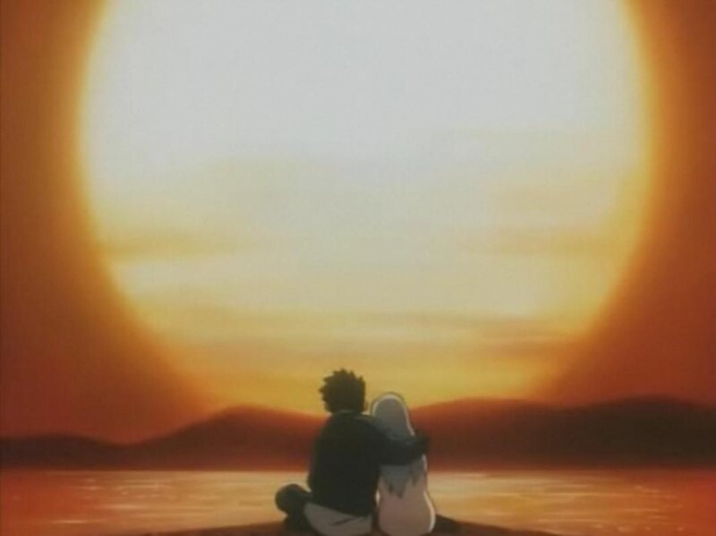 Two People Sitting Together